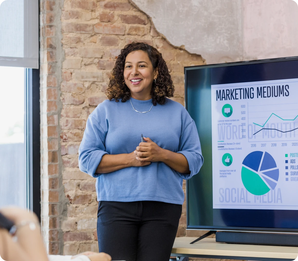 Speaker in front of marketing presentation slides